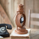 Vintage style lantern clock

Fashioned as a repurposed kerosene lantern, this unique clock will bring a rustic touch to a home. This item can be hung with a hook by its metal loop or placed on a shelf. This clock requires one AA battery, which is not included with your purchase.

Materials:
Metal, plastic

Dimensions:
8" wide x 6" deep x 12 3/4" high