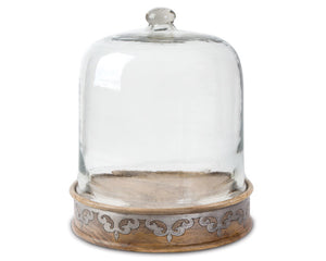 Glass cloche with wooden base on a white background