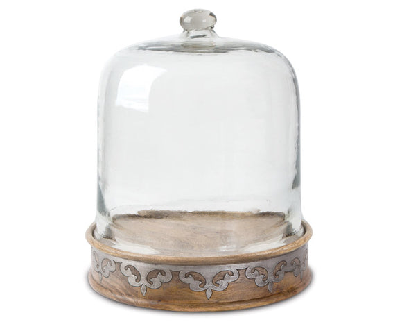 Glass cloche with wooden base on a white background