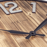 Large wooden wall hanging clock

This large industrial wall clock has a real wooden clock face with a visible natural wood grain pattern. The combination of oversized silver numbers set in slim black metal rims and black hands gives it a rural, yet modern sophisticated touch. This clock runs on one AA battery, which is not included with your purchase.

Materials:
Wood, metal

Dimensions:
20" diameter
