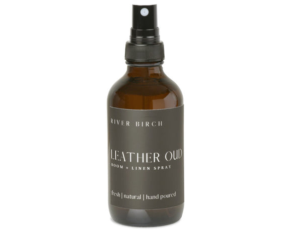 Brown leather spray bottle with black label on a white background