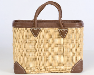 Rectangular straw tote with leather accents

This rectangular straw tote with genuine leather accents is an essential accessory for your shopping needs. This bag is not only practical, it also carries the heritage of longtime artisans. It is ideal for use in the home, kitchen, or even for organization.&nbsp;

Materials:
Wicker, leather

Dimensions:
11" high x 6" deep x 16 1/2" wide

Care:
Spot-clean only
