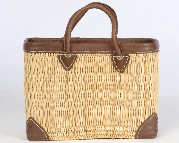 Rectangular straw tote with leather accents

This rectangular straw tote with genuine leather accents is an essential accessory for your shopping needs. This bag is not only practical, it also carries the heritage of longtime artisans. It is ideal for use in the home, kitchen, or even for organization. 

Materials:
Wicker, leather

Dimensions:
11