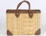 Rectangular straw tote with leather accents

This rectangular straw tote with genuine leather accents is an essential accessory for your shopping needs. This bag is not only practical, it also carries the heritage of longtime artisans. It is ideal for use in the home, kitchen, or even for organization.&nbsp;

Materials:
Wicker, leather

Dimensions:
11" high x 6" deep x 16 1/2" wide

Care:
Spot-clean only