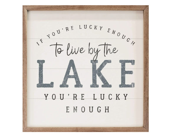 Lake-themed framed wall hanging artwork 
*Made to order*

This unique piece is a simple way to bring beauty and charm to any wall within the home. It is made from high quality American hardwood planks with a hand painted face, and printed with UV cured ink, and is framed in a natural walnut frame. Each piece is unique with its own personality, marks, wood grain, and look.

Materials:
Wood

Dimensions:
16
