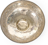Gold-colored decorative bowl with a textured surface on a white background