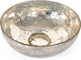 Silver metallic bowl with reflective surface on a white background