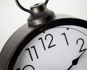 Vintage style round black metal desk clock

Step back in time with this antique-inspired black metal desk clock. Featuring bold numbers, wood accents, and a handle that resembles the olden days, this time keeper will help you stay on task and on schedule.

Materials:
Metal

Dimensions:
6 1/2" wide x 2" deep x 9 1/2" tall
