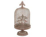 Decorative metal bell jar with intricate design on a white background