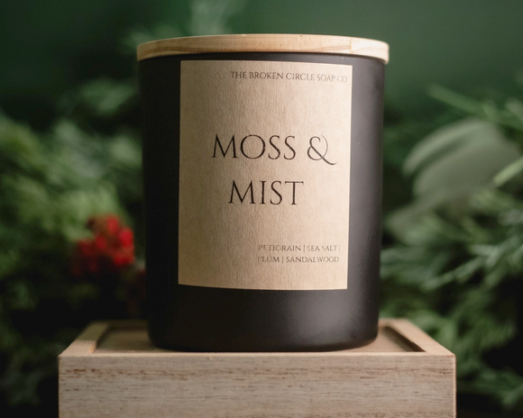 Mystery and warmth are wrapped in winter’s hush with this candle, offering a bright petit-grain and fresh ozone with juicy plum and cooling eucalyptus, resting on a cozy bed of sandalwood and musk. It’s the scent of a quiet forest dawn after a soft snowfall. This candle has three wicks for a steady, even glow. It is crafted of non-toxic, paraben - and phthalate-free oils. The candle is encased in a matte black ceramic jar with a natural wooden lid.