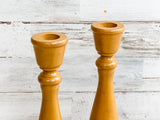  If you’re looking for rustic dining table decorations or fireplace mantel decor, look no further! These wooden candle holders complement almost any home or dining room decor, including coastal farmhouse. Place several of these candle holders in a group on a dining room table for centerpiece or on a mantel in a living room for a vintage-inspired candlescape. These candle holders also make for a great gift. The possibilities are endless!

Sold in pairs, each candle holder features a brown and mustard yellow 