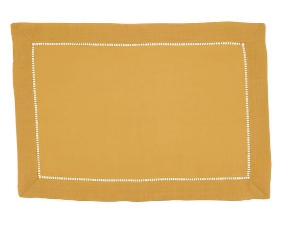 Mustard yellow placemat with white border on a white background