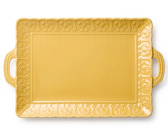Mustard yellow embossed floral serving platter made of stoneware