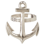 Silver anchor-shaped napkin ring on a white background