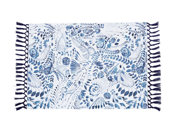 Add traditional charm to your dining table with these lovely placemats. Each one features a navy blue and white floral design accented by tassels in each end. These placemats, which are sold individually, are a great way to a feminine touch to dining area without using pastels. They also make for great wedding gifts.  These placemats are proudly made in the USA.  Materials: 100% Cotton   Dimensions: 14