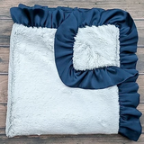 Luxurious navy blue &amp; silvery gray ribbon blanket
*Made to order*

Made from high-quality Minky fabrics, which comprise luxuriously soft microfibers, this navy blue and pale gray baby blanket features a matching satin ruffle trim. It is the perfect size for nap time cuddles. This blanket would be a great choice for a baby shower gift.

This item is proudly made in the USA.
