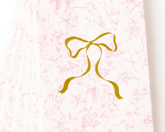 Gold bow design on a pink textured background