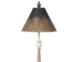 Decorative lamp with a dark shade and wooden base on a white background