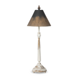 Table lamp with a distressed white base and black shade on a white background