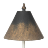 Decorative lamp with a black and gold shade on a white background