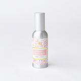 Room spray bottle with floral label on a white background