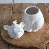 White ceramic piglet cookie jar