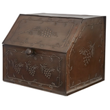 Decorative metal bread box with embossed designs on a white background