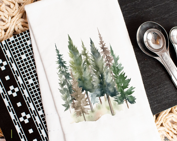 Notebook with a forest illustration on a textured surface with measuring spoons.
