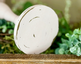 If you’re looking for shabby cottage chic dining table decorations or shelf decor, look no further! These hand-painted, wood candle holders complement almost any home or dining room decor. And they are a great choice for a farmhouse chic wedding reception. Place several of these candle holders in a line for centerpiece or on a mantel in a living room for a vintage-inspired candlescape.