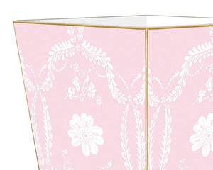 Pink floral wastebasket&nbsp;

Enhance your space with our beautifully hand-painted wood wastepaper basket. Each basket is crafted with care, combining durability with stunning artistry, making them a perfect addition to any room. The artwork is hand-cut, decoupaged, and polished by a small team of artisans in Texas. Each wastepaper basket is carefully painted gold around the edges as the perfect finishing touch.
