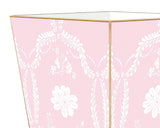 Pink floral wastebasket&nbsp;

Enhance your space with our beautifully hand-painted wood wastepaper basket. Each basket is crafted with care, combining durability with stunning artistry, making them a perfect addition to any room. The artwork is hand-cut, decoupaged, and polished by a small team of artisans in Texas. Each wastepaper basket is carefully painted gold around the edges as the perfect finishing touch.
