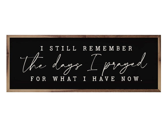 'The Days I Prayed For' black wall sign 
*Made to order*

This unique piece is a simple way to bring beauty and charm to any wall or shelf within the home. It is made from high-quality American hardwood planks with a hand-painted face, printed with UV-cured ink, and framed in a natural walnut frame. Each piece is unique with its own personality, marks, wood grain, and look. 

Materials:
Wood, hanging hardware

Dimensions:
8