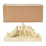 Distressed rabbit table lamp with shade

Set a relaxing tone in your home with this group of sleeping bunnies. The light from the lamp spotlights how precious and content these little friends are and passes that feeling on to you. The base has a white washed finish. Let these sleepy friends be the light in your room.

Materials:
Resin, linen fabric

Dimensions:
13" high x 5 1/2" wide x 14" long