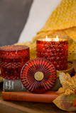 Red 'Holiday Spice' holiday candle&nbsp;

Featuring hints of nutmeg, cinnamon and cardamom with vanilla bean and mandarin zest, this gorgeous hand-poured candle is perfect for the holidays and winter. It comes in a shimmery glass jar with matching lid. The container is beautiful and can easily be repurposed when the time comes. This candle, which is vegan and cruelty free, is a great option for a secret Santa gift.

This item is proudly made in the USA.