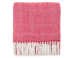 Red and white herringbone patterned throw blanket with fringes on a white background
