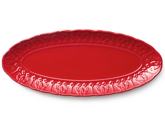 Red embossed oval platter

Elevate your serveware collection with this stoneware centerpiece that brings artisan elegance to presentations. Whether you're plating grilled salmon, paella, or a medley of roasted vegetables, this elongated platter offers a stunning surface that combines function with refined beauty. The embossed motif and textured flourishes provide visual interest, while the red finish brings warmth to your table. 