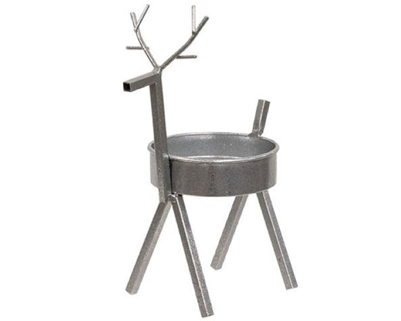 Decorative metal reindeer planter on a white background