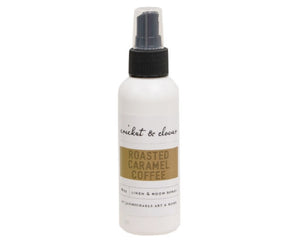 White spray bottle labeled 'Roasted Caramel Coffee' on a white background