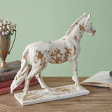 This majestic equine boasts elements from the architecture of the Roman Empire. Feature on a table or shelf for a quick, sophisticated touch in a room. This piece is a great choice for a gift.  Materials: Resin  Dimensions: 11 1/4" high x 3 1/2" deep x 13" wide