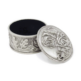 Pewter vintage rose embossed round box

This beautiful trinket box is perfect for storing keepsakes, small pieces of jewelry, rosary beads and other sentimental mementos. It is made of pewter alloy, features a hand-embossed design, and a premium black velvet interior.&nbsp;

Materials:
Pewter, velvet

Dimensions:
2 1/4" diameter x 1 1/4" high