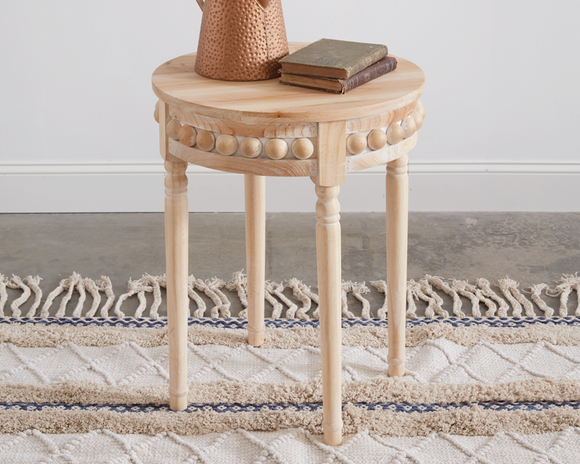 Wooden beaded round side table

Exuding natural beauty, our wood side table features beaded accents that will accentuate your bohemian style. It’s the perfect place to showcase your favorite photo frame or set a cup of coffee in the mornings. It is made of fir wood and requires some assembly. 

Materials:
Wood

Dimensions:
20