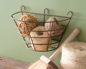 Keep things organized in any room of a farmhouse home with this rustic basket. This basket is made of metal with a rustic finish. At almost 1 foot wide, this is large enough to hold small toys and craft supplies. To hang, use its three screw hole hangers.<br><br>Materials:<br>Metal<br><br>Dimensions:<br>6 3/4" high x 6 1/2" deep x 10" wide<br>