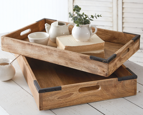 These quality-made trays would go great on shelves, coffee tables, or the kitchen countertop to display your favorite items or serve refreshments. Made of solid mango hardwood, this set of trays has metal corner accents. This set is a great gift choice.