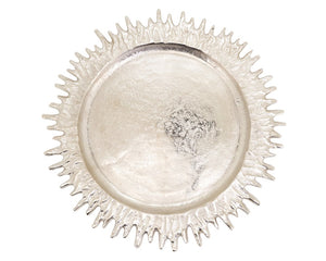 Decorative silver plate charger with a textured rim on a white background