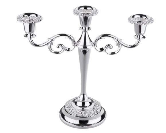 There are a few staples that every Southern home must have for holidays - silver candelabras. Almost every Southern lady can remember time spent as a child helping polish the silver with her grandmother. Silver candelabras are classic and worth the investment. They can be passed on down through generations. Because this particular candelabra, which is made in the United Kingdom, is shorter than 12 inches, it is a great height for using as a dining table centerpiece that won't block the view of your guests.