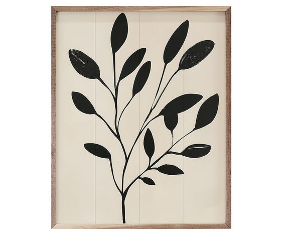 Framed artwork with black leaf design on a beige background