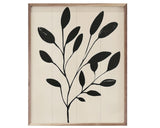 Framed artwork with black leaf design on a beige background