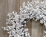 The Snowball Glittered Wreath is a decorative wintertime wreath with a rustic dark brown twig base. The wreath features spindly branches with round white berries, all coated in a thick white flocking and silver sparkles, for a fresh and icy snow-frosted effect. This wreath makes a beautiful addition to the home during Winter and Christmas, offering a simple yet festive touch to a door or wall. Measures 9” in diameter (inner) and 20-22" in diameter (outer). 