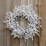 The Snowball Glittered Wreath is a decorative wintertime wreath with a rustic dark brown twig base. The wreath features spindly branches with round white berries, all coated in a thick white flocking and silver sparkles, for a fresh and icy snow-frosted effect. This wreath makes a beautiful addition to the home during Winter and Christmas, offering a simple yet festive touch to a door or wall. Measures 9” in diameter (inner) and 20-22" in diameter (outer). 