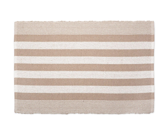 This striped rug makes a perfect kitchen rug, bathroom rug, or entryway rug. It features a stone brown and cream cabana striped design. It is double sided for longer life. It can also be rolled or folded for storage. A rug pad is recommended to avoid transfer of color and additional softness. 

Materials:
100% Cotton

Dimensions:
24